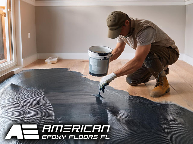 male professional technician performing professional installation pouring epoxy onto floor in residential setting